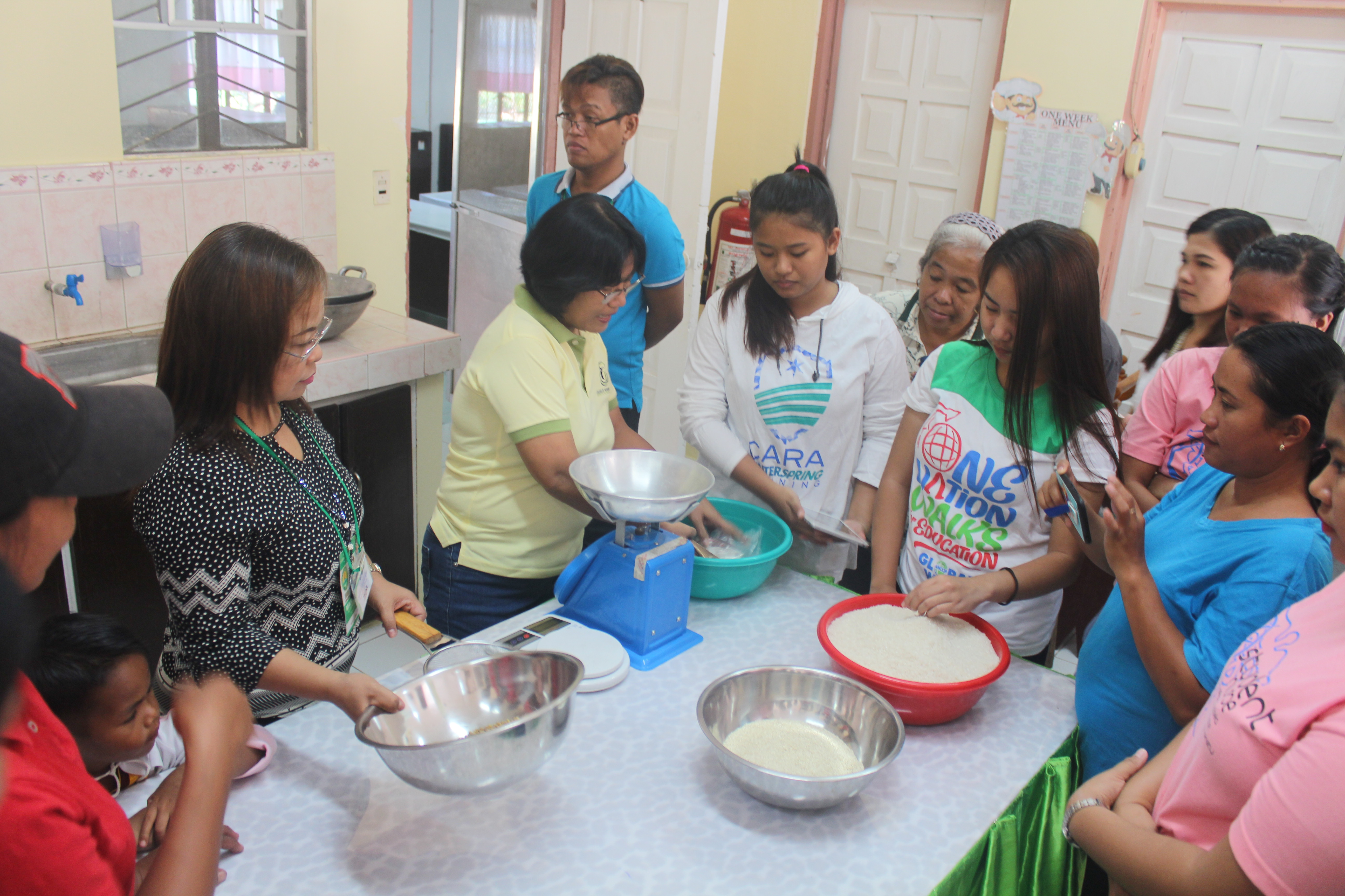 Participants of the PNEA training held at the Isabela State University are given hands-on training on the production of KALINGA supplementary mix. Photo: Arnold Abuyog